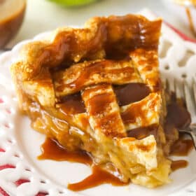 A large slice of caramel apple pie on a plate.