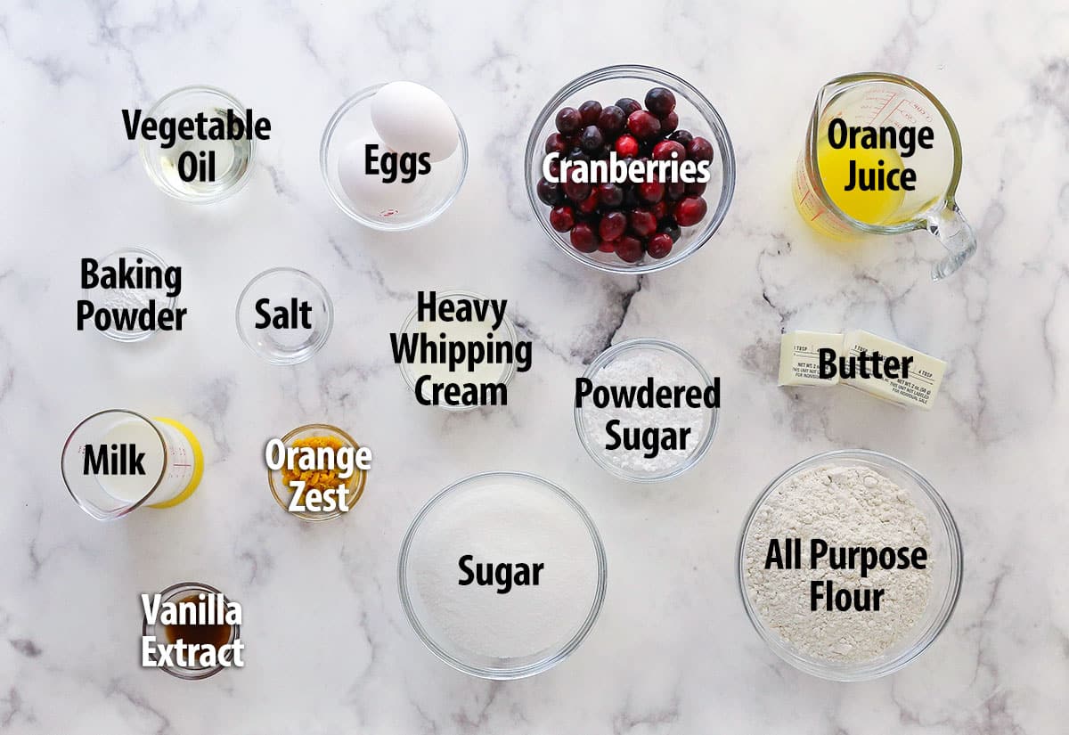 This glazed cranberry orange loaf combines bright, tangy flavors with a perfectly moist, tender crumb. It's the perfect holiday treat! Labeled ingredients for orange cranberry loaf.