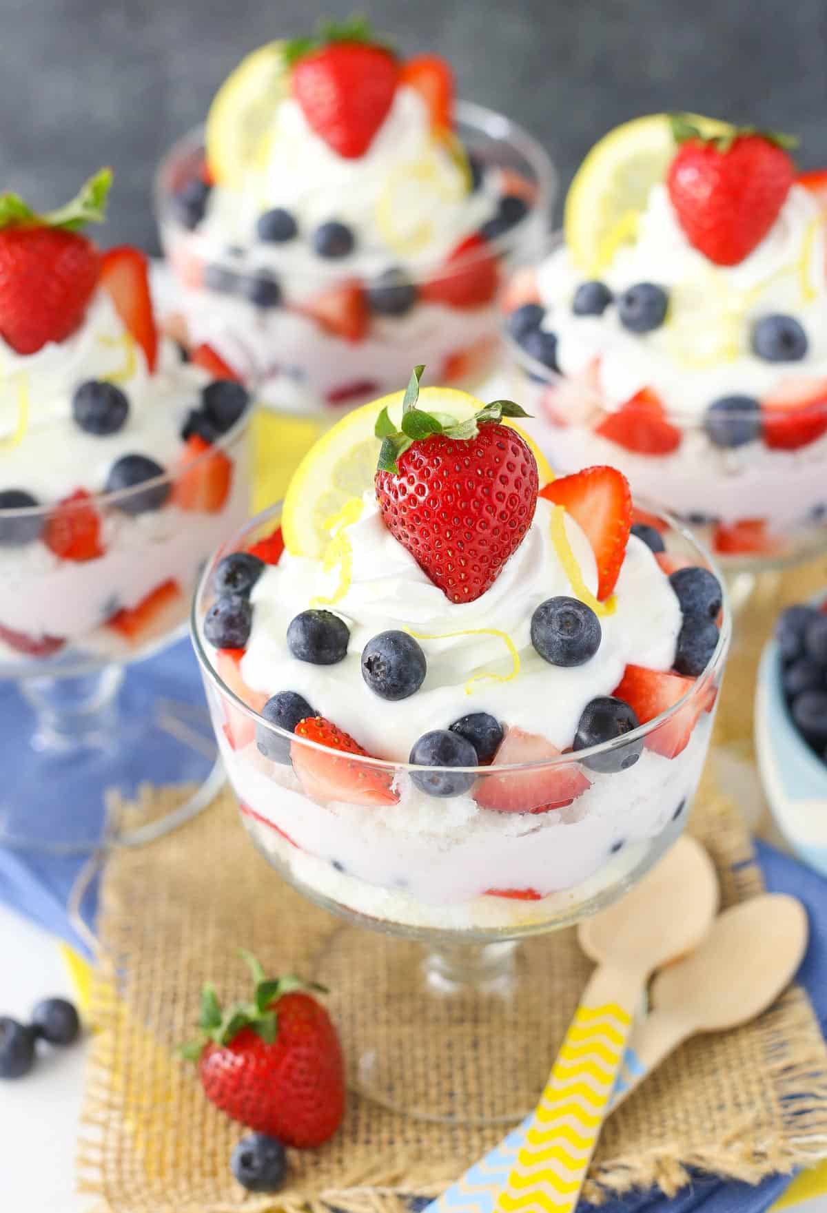 Side view of four lemon berry yogurt trifles.