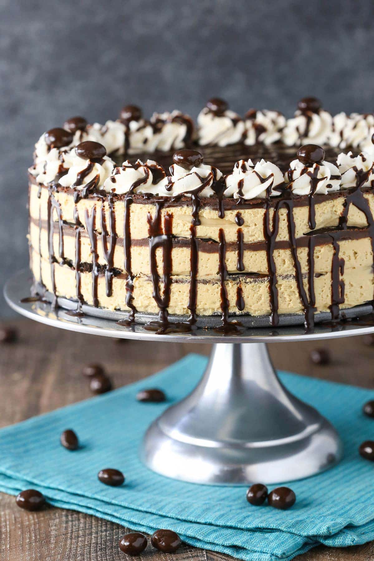 Close up of a mocha chocolate icebox cake on a silver cake stand.