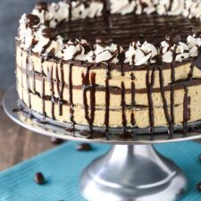 Close up of a mocha chocolate icebox cake on a silver cake stand.