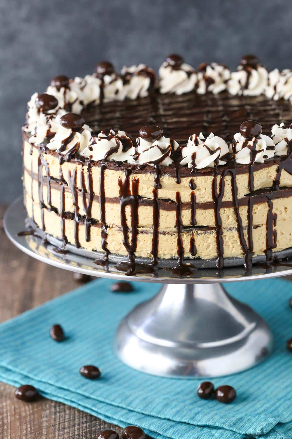 Close up of a mocha chocolate icebox cake on a silver cake stand.