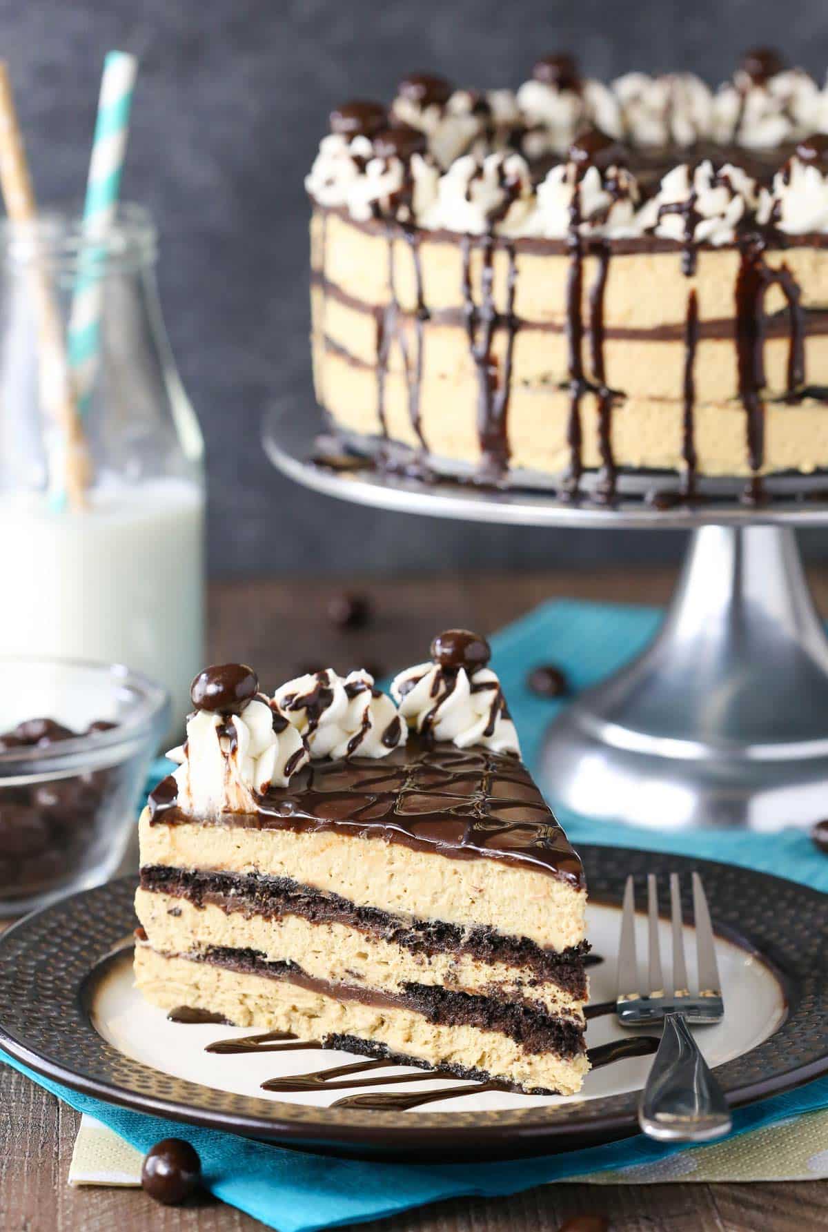 A slice of mocha chocolate icebox cake on a black and white plate.