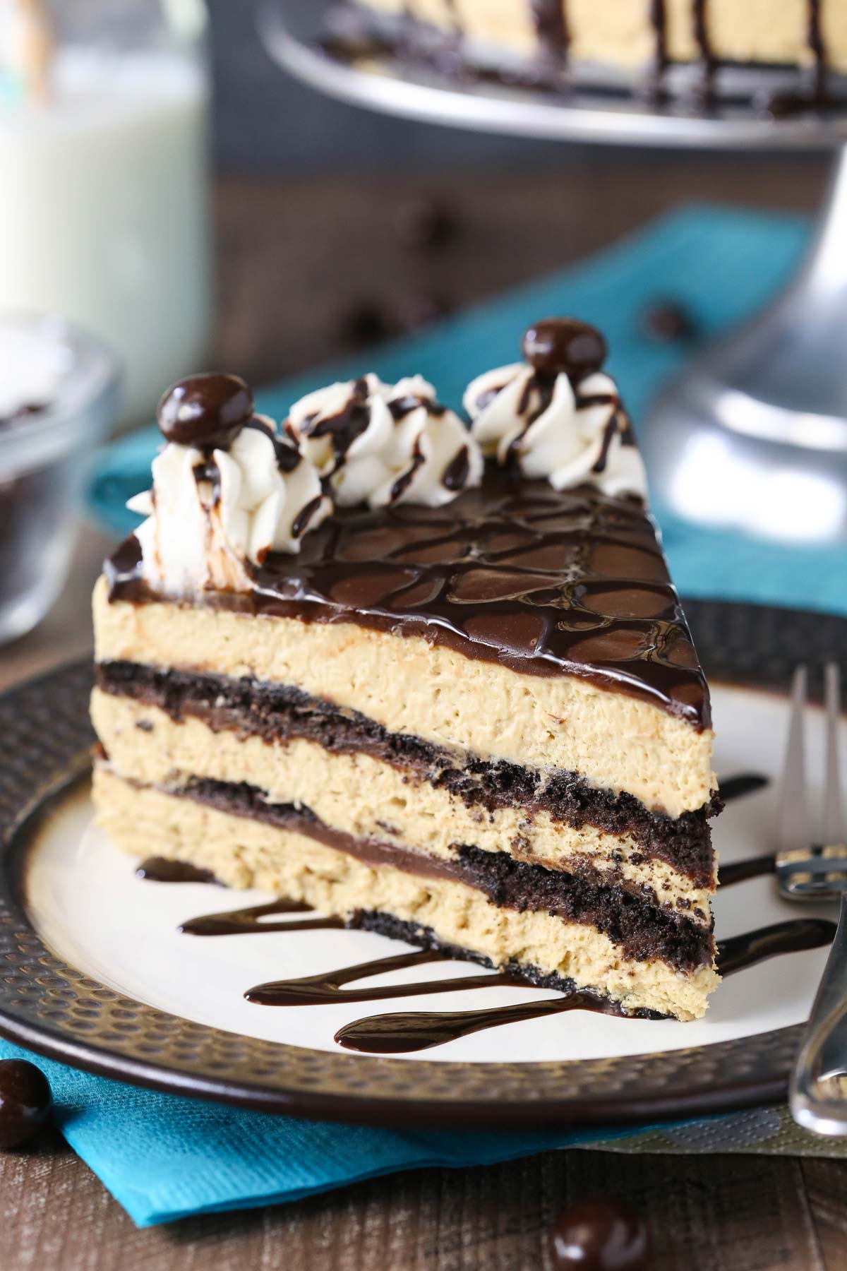 Close up of a mocha chocolate icebox cake on a black and white plate.