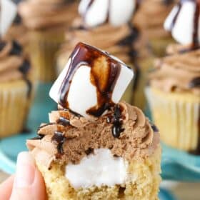 Close up of a Nutella fluffernutter cupcake with a bite taken out of it.