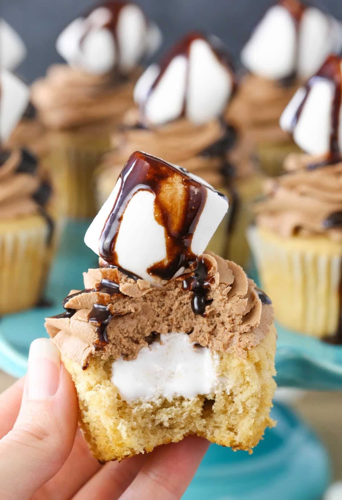 Close up of a Nutella fluffernutter cupcake with a bite taken out of it.