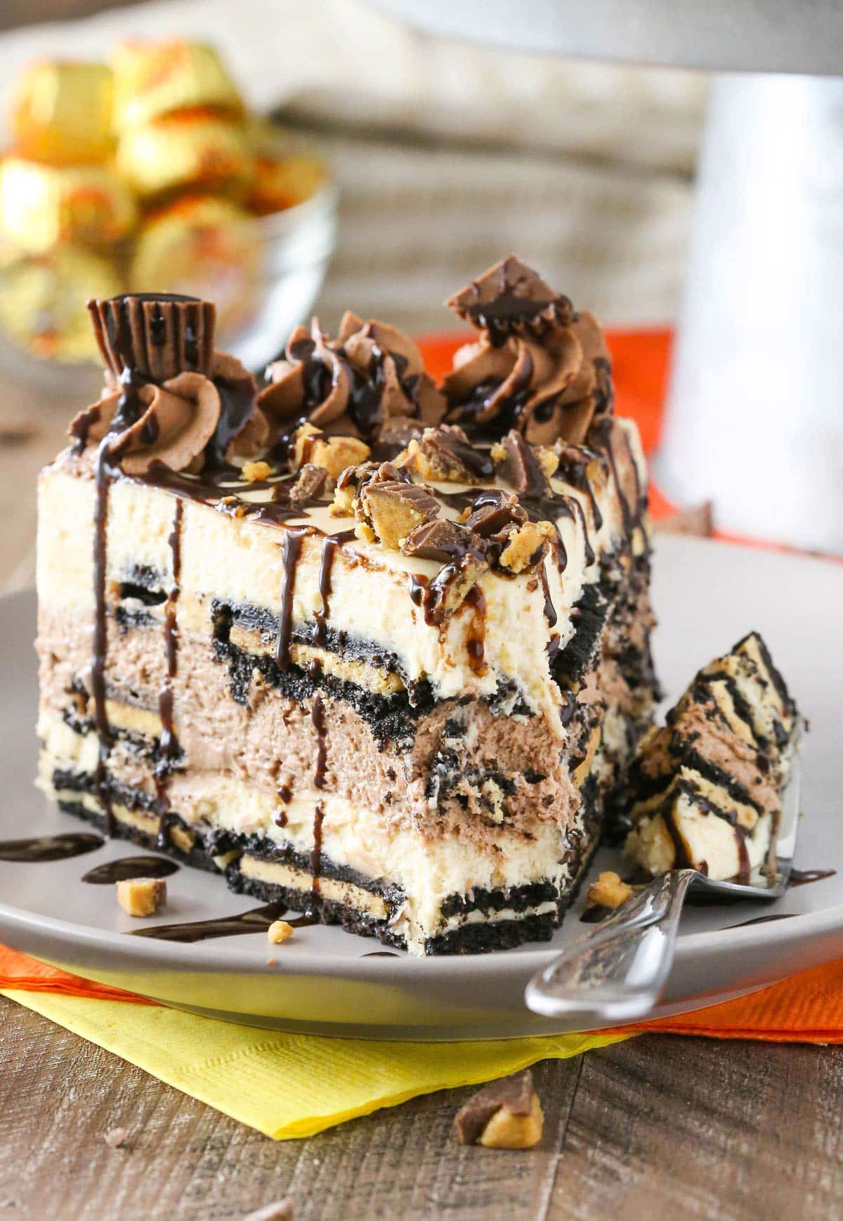 A slice of Reese's peanut butter chocolate icebox cake with a bite removed on a fork.