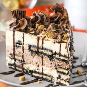 A slice of Reese's peanut butter chocolate icebox cake on a grey plate.