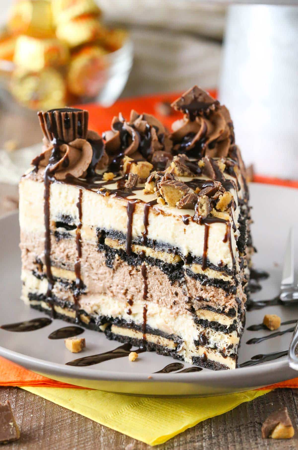 A slice of Reese's peanut butter chocolate icebox cake on a grey plate.