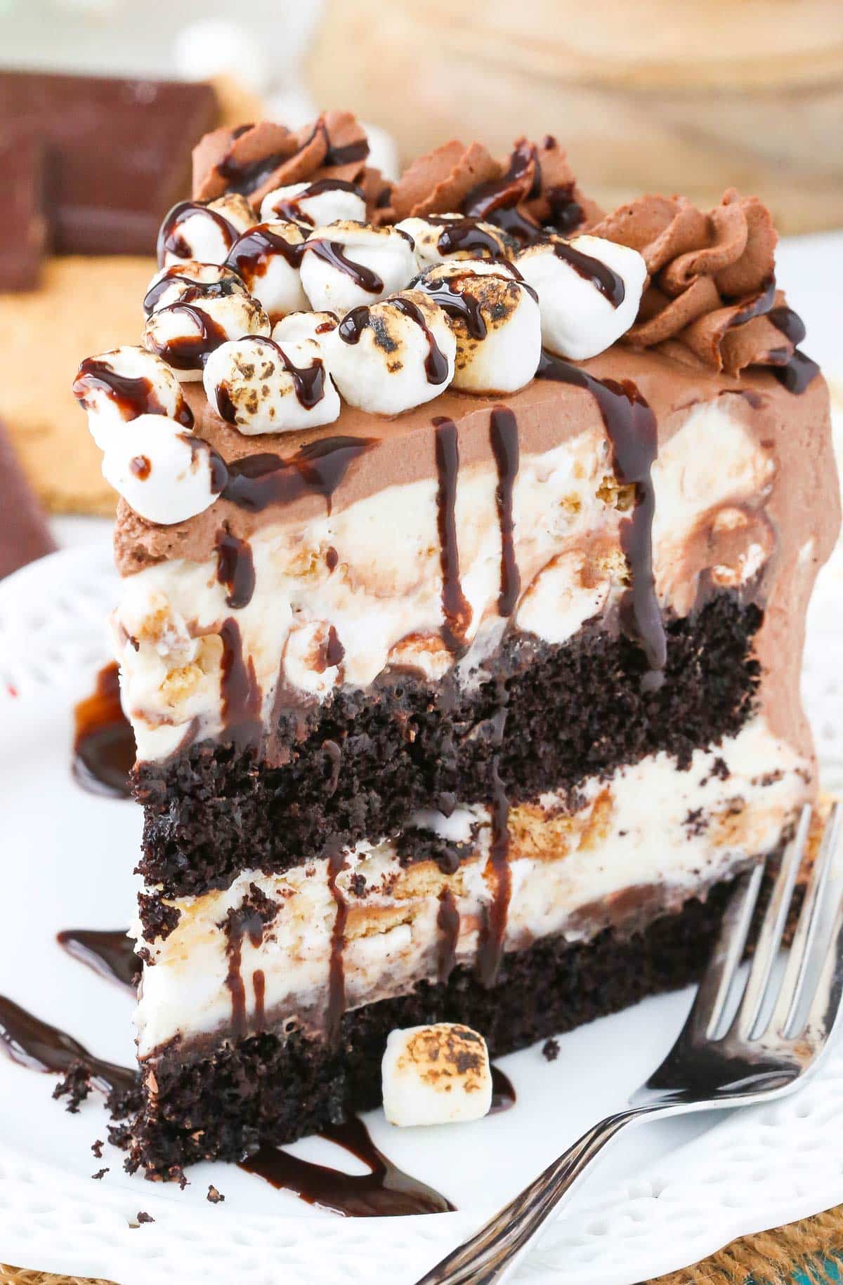 A slice of s'mores ice cream cake on a white plate.