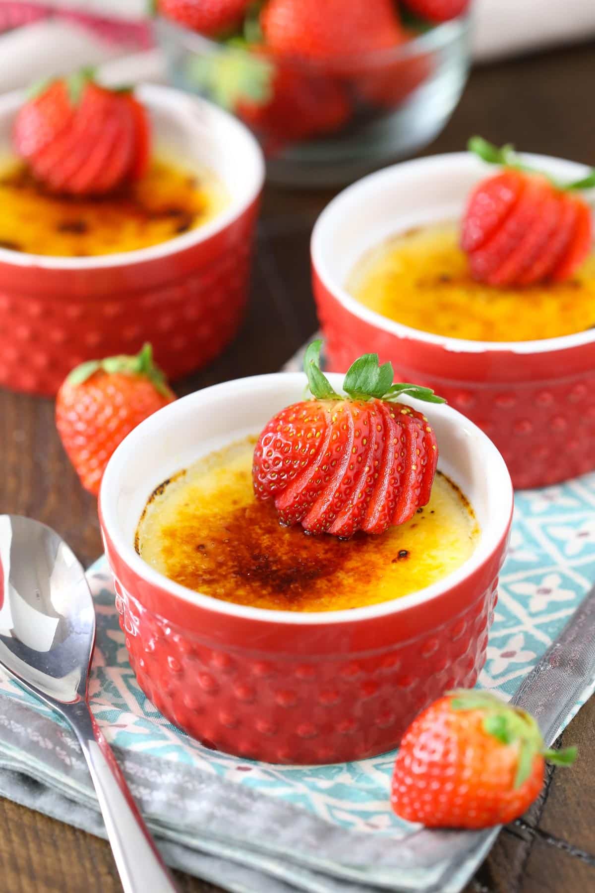 Close up of a ramekin filled with strawberries brulee.