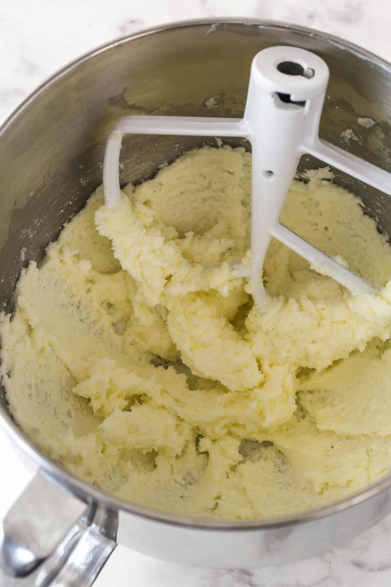 Creaming together butter and sugar for strawberry cake batter.