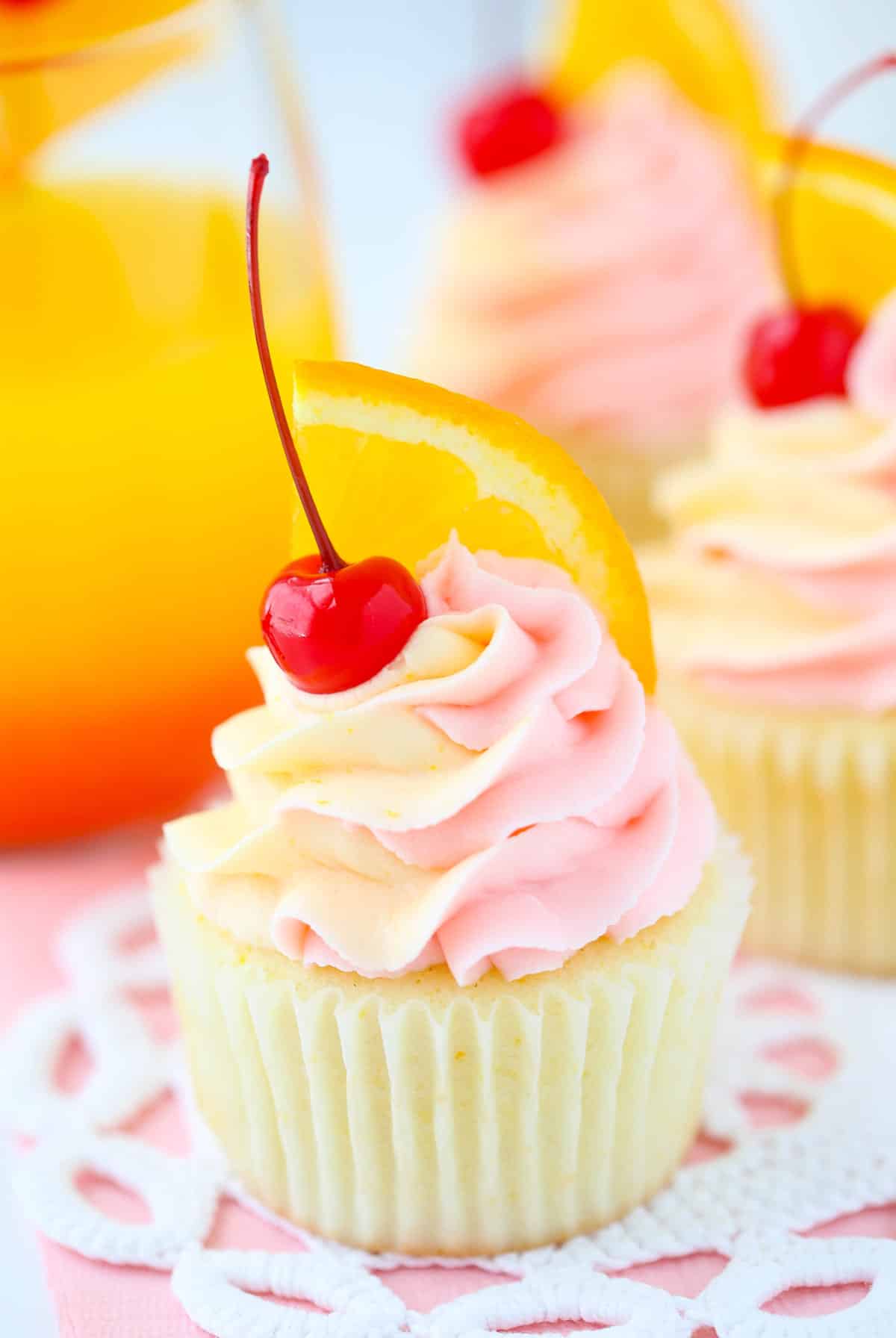Close up of a tequila sunrise cupcake.