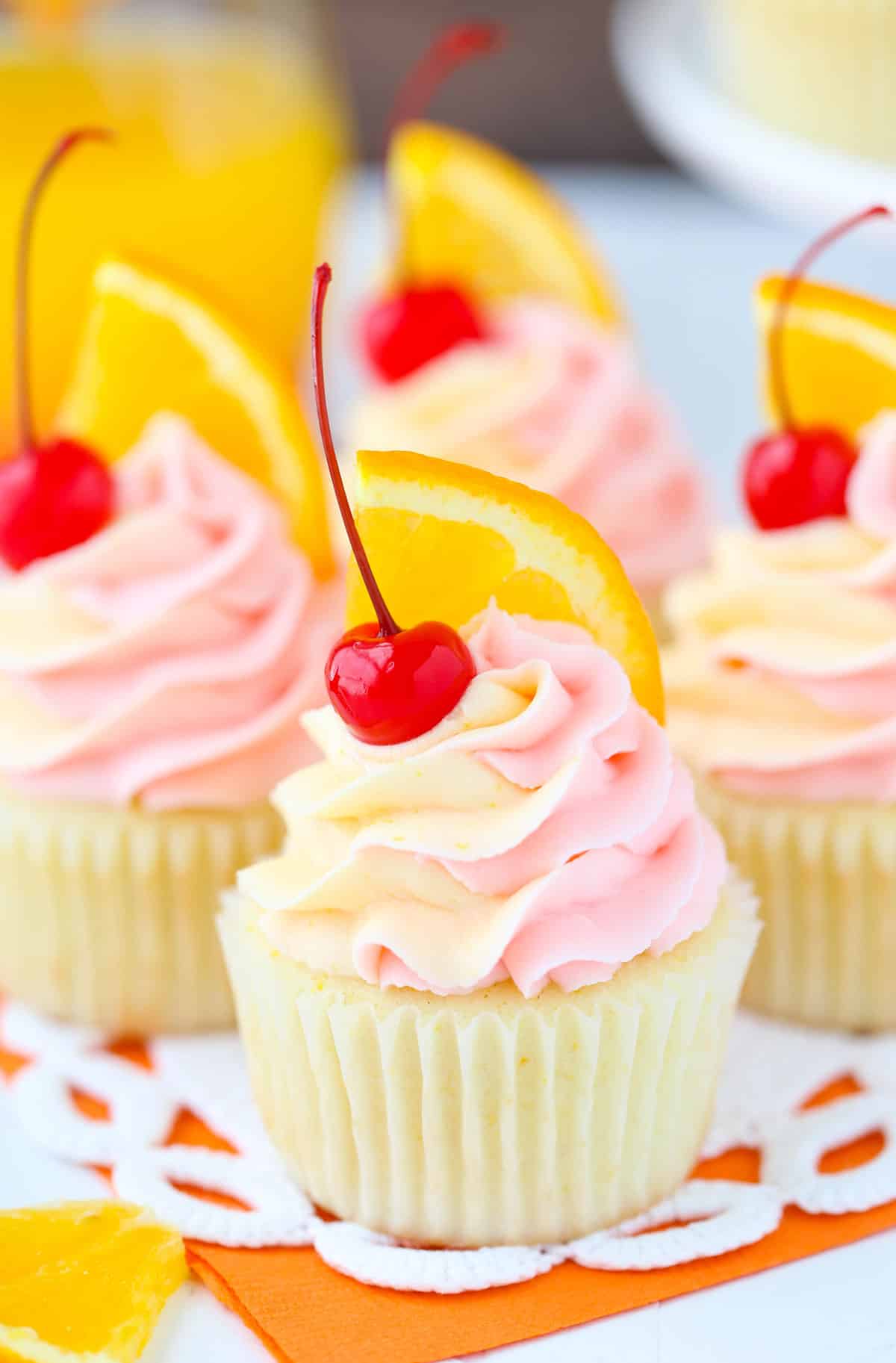 Close up of a tequila sunrise cupcake.