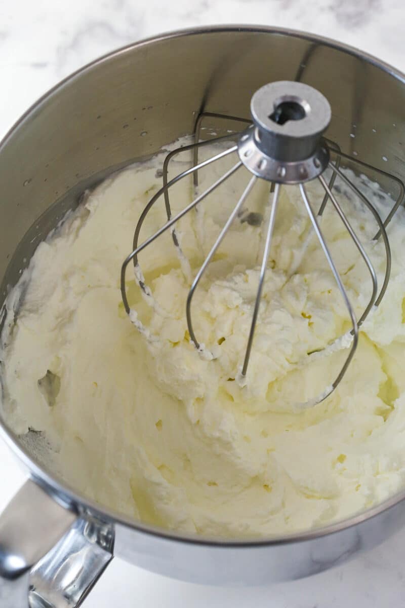 whipped cream in a mixing bowl with the whisk attachment