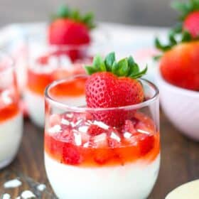 Close up of a strawberry white chocolate mousse cup.