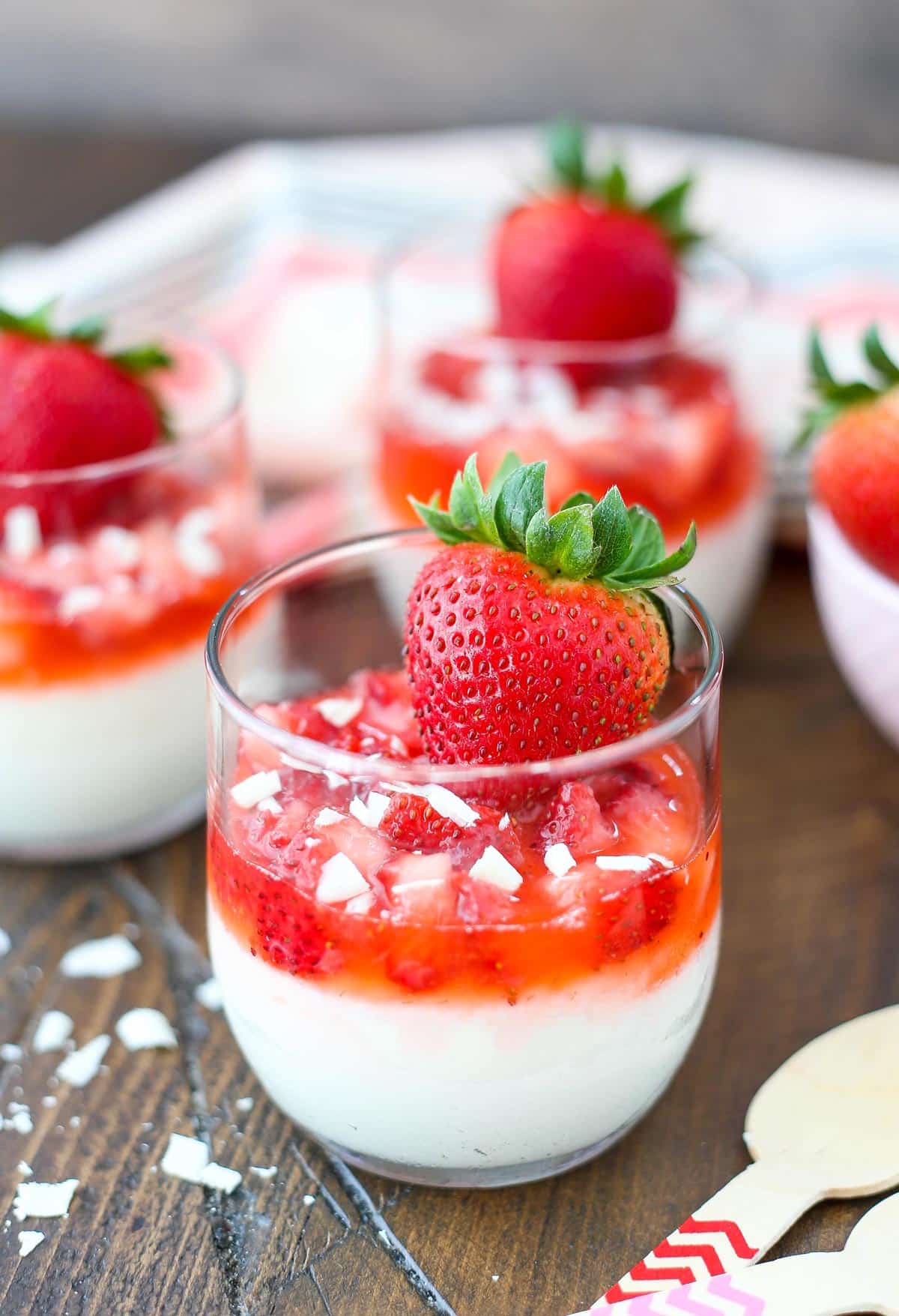 Close up of a strawberry white chocolate mousse cup.