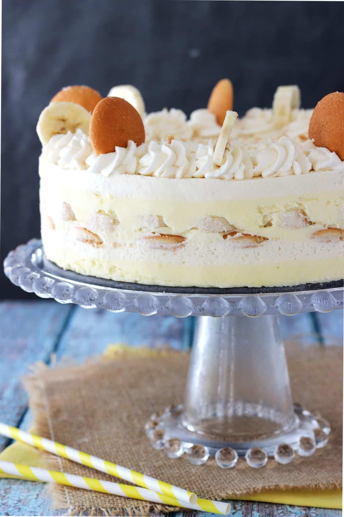 Close up of a banana pudding icebox cake on a glass cake stand.
