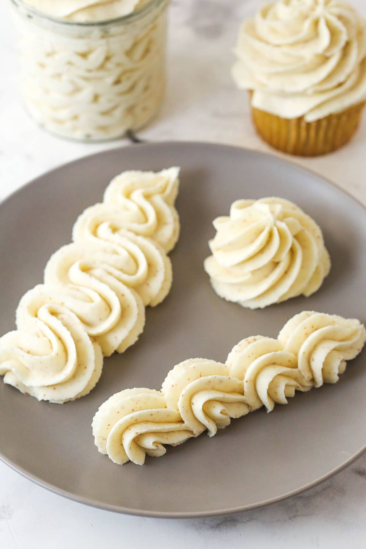 brown butter buttercream piped onto grey plate