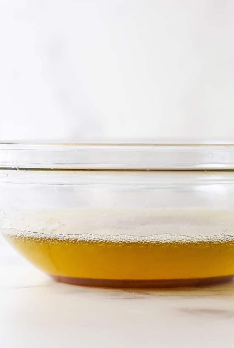 These brown sugar cutout cookies are the best! Browning the butter gives them a nutty, caramelized flavor and a dreamy, soft, chewy texture. Browned butter in a bowl.