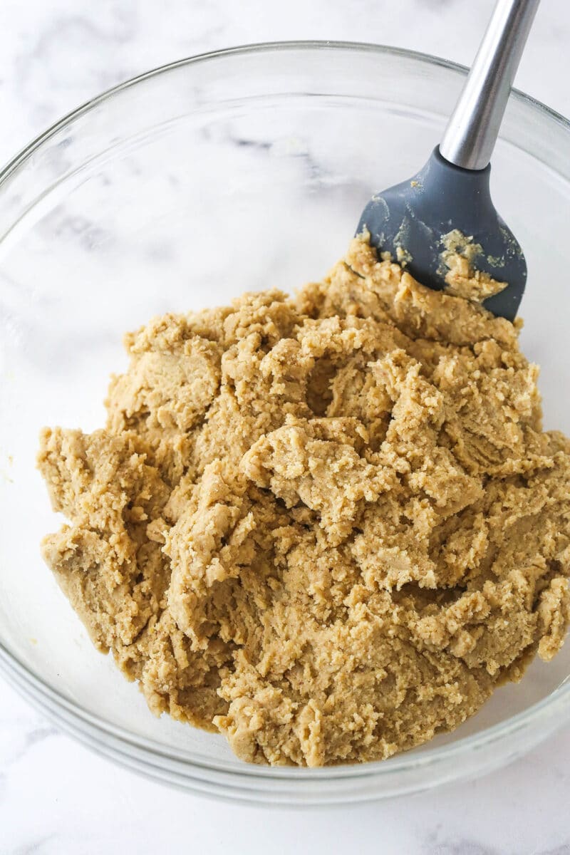 These brown sugar cutout cookies are the best! Browning the butter gives them a nutty, caramelized flavor and a dreamy, soft, chewy texture. Chilled brown sugar cookie dough in a bowl.
