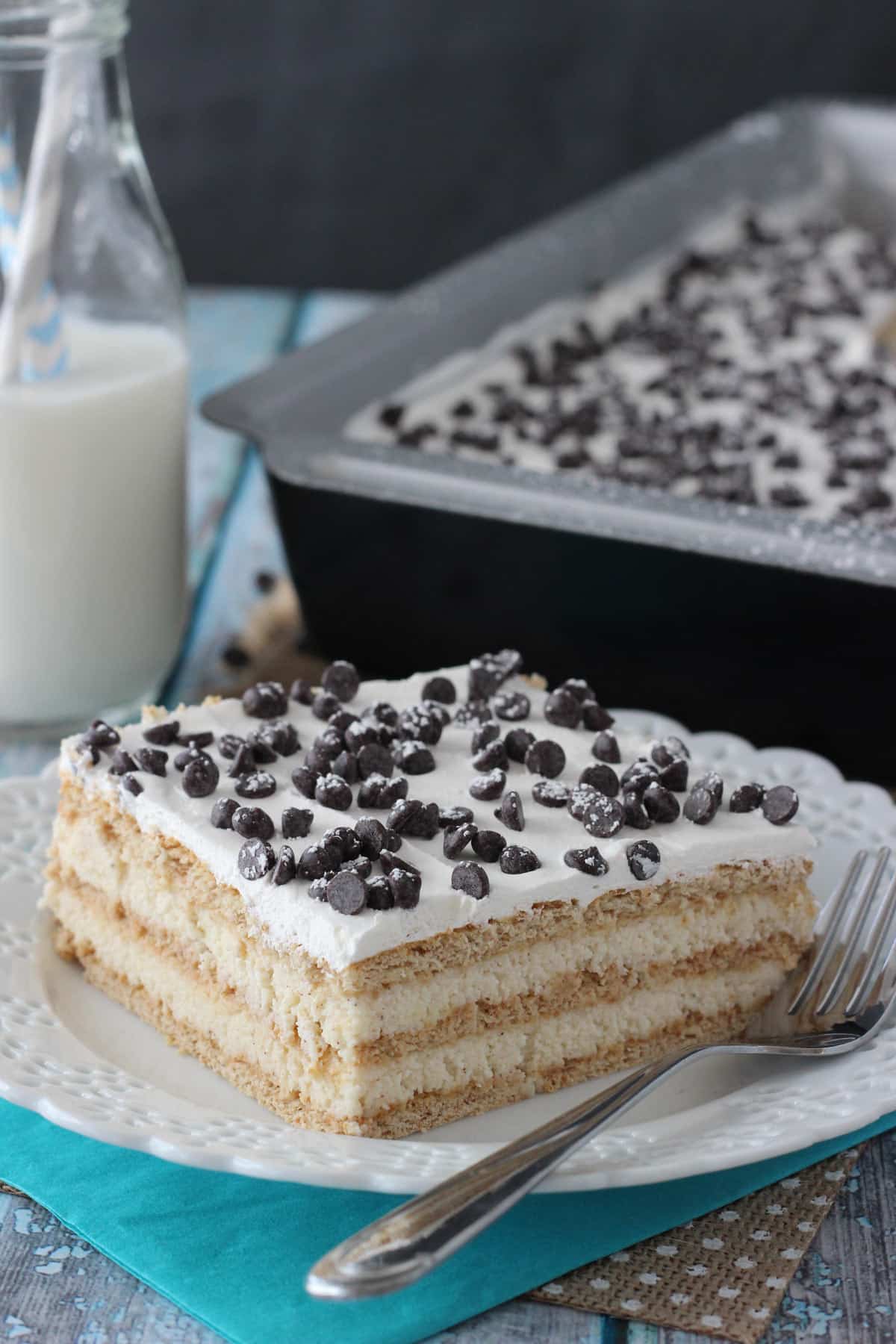 A slice of cannoli icebox cake on a small white plate.