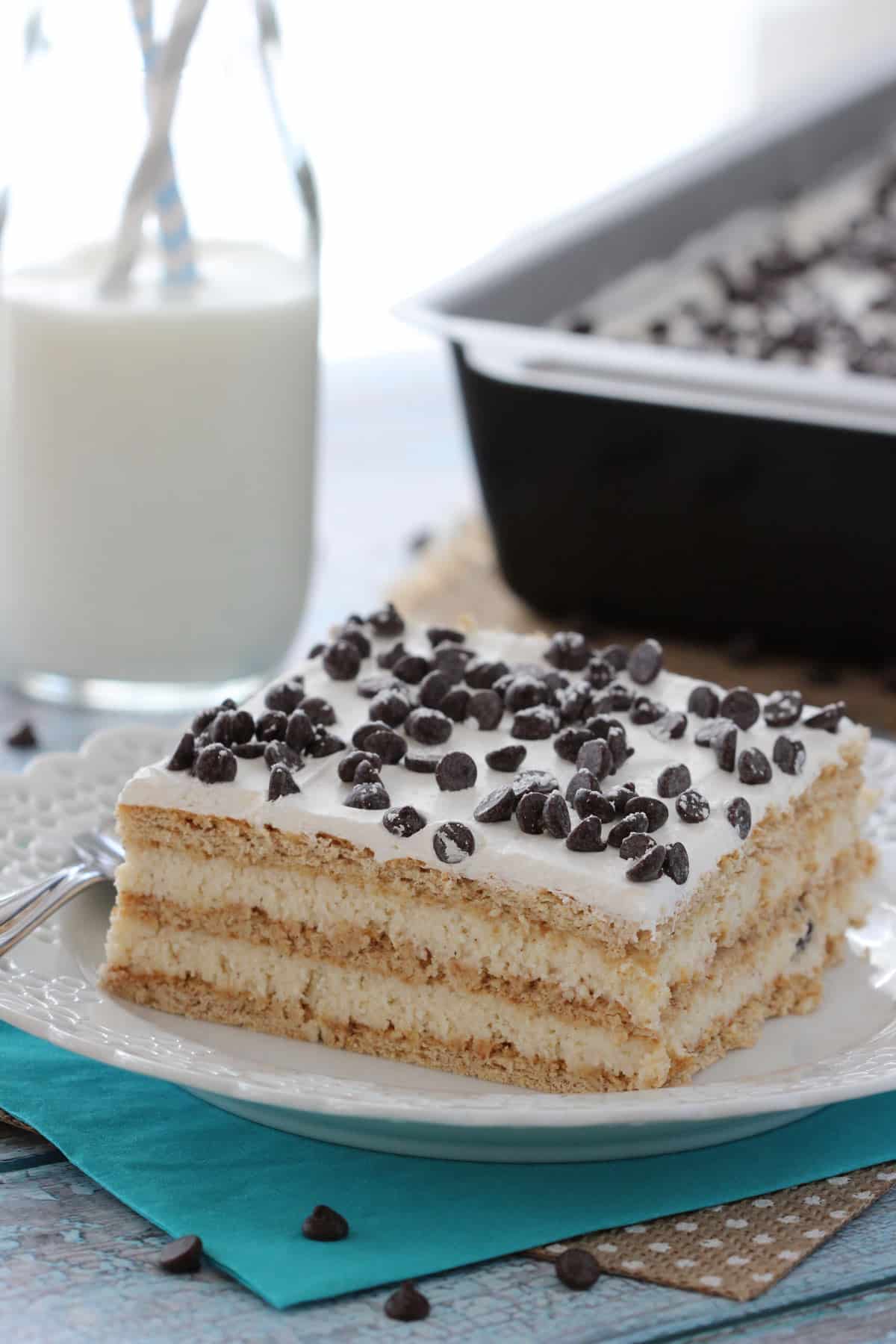 A slice of cannoli icebox cake on a small white plate.