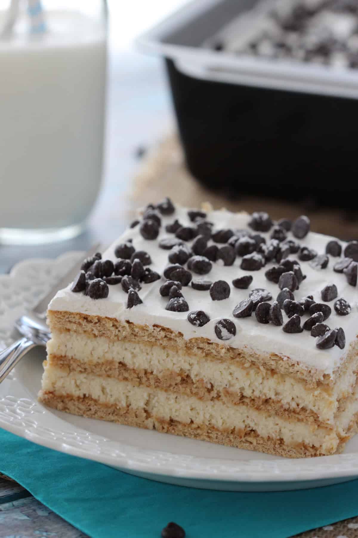 Close up of a slice of cannoli icebox cake on a small white plate.