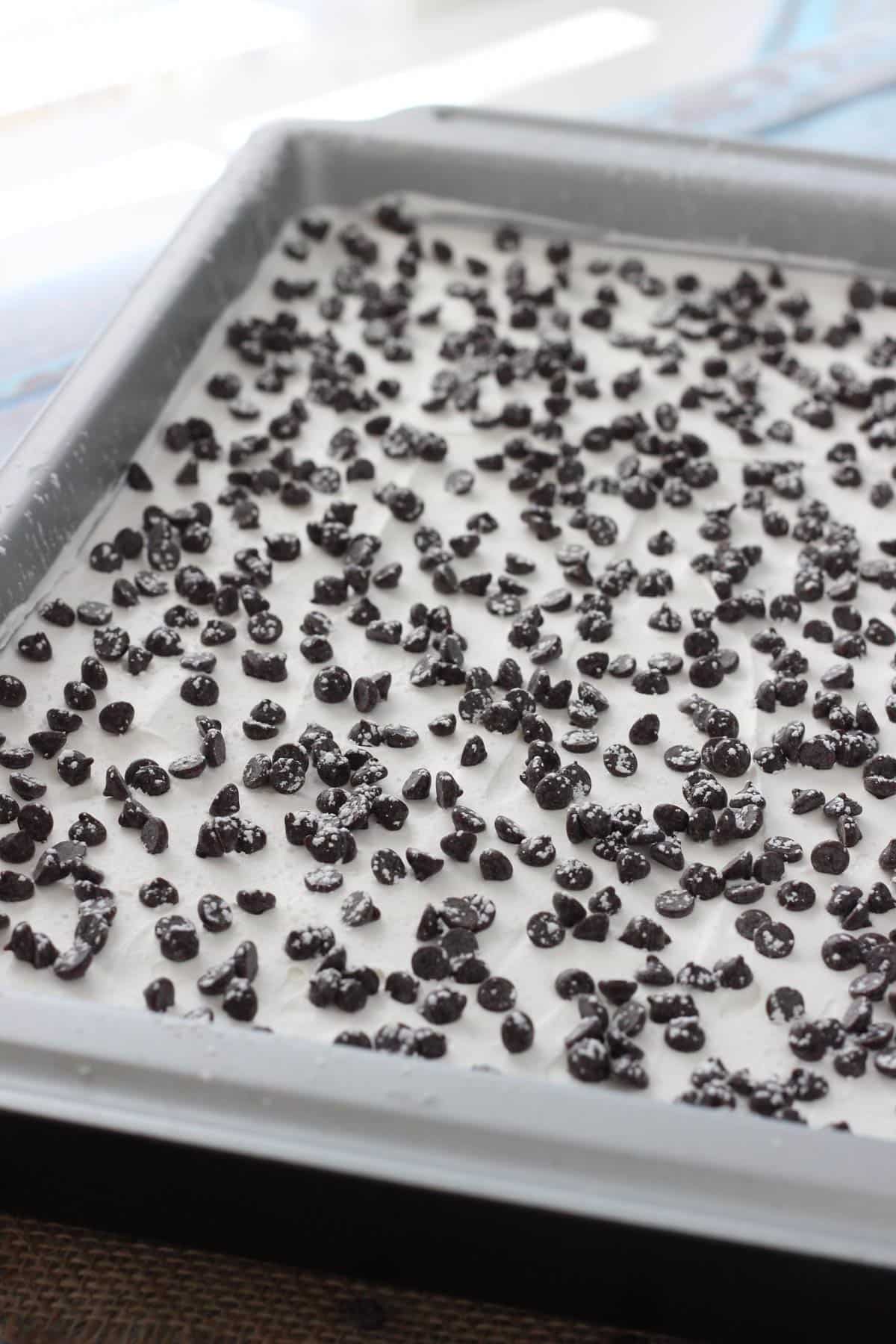 A cannoli icebox cake in a baking pan.