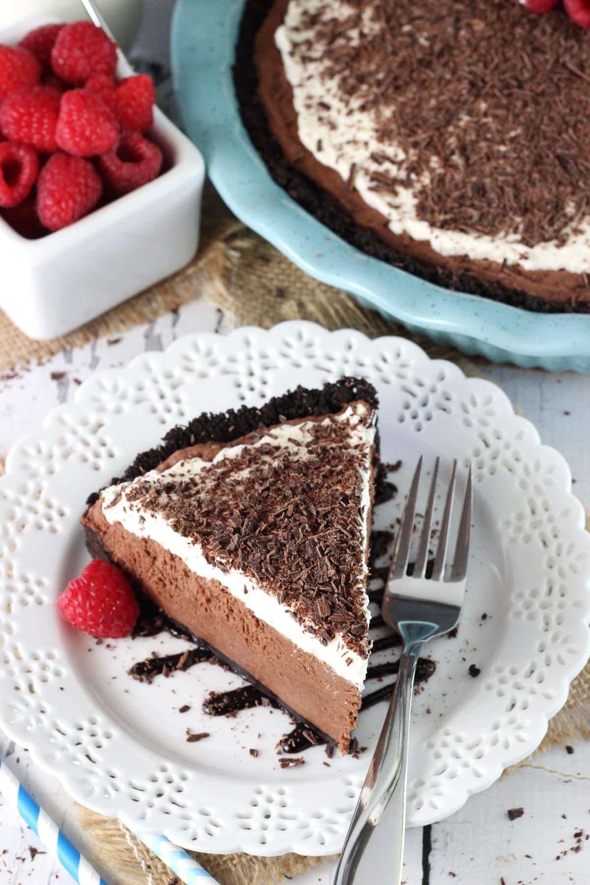 A slice of chocolate truffle pie on a white dessert plate.