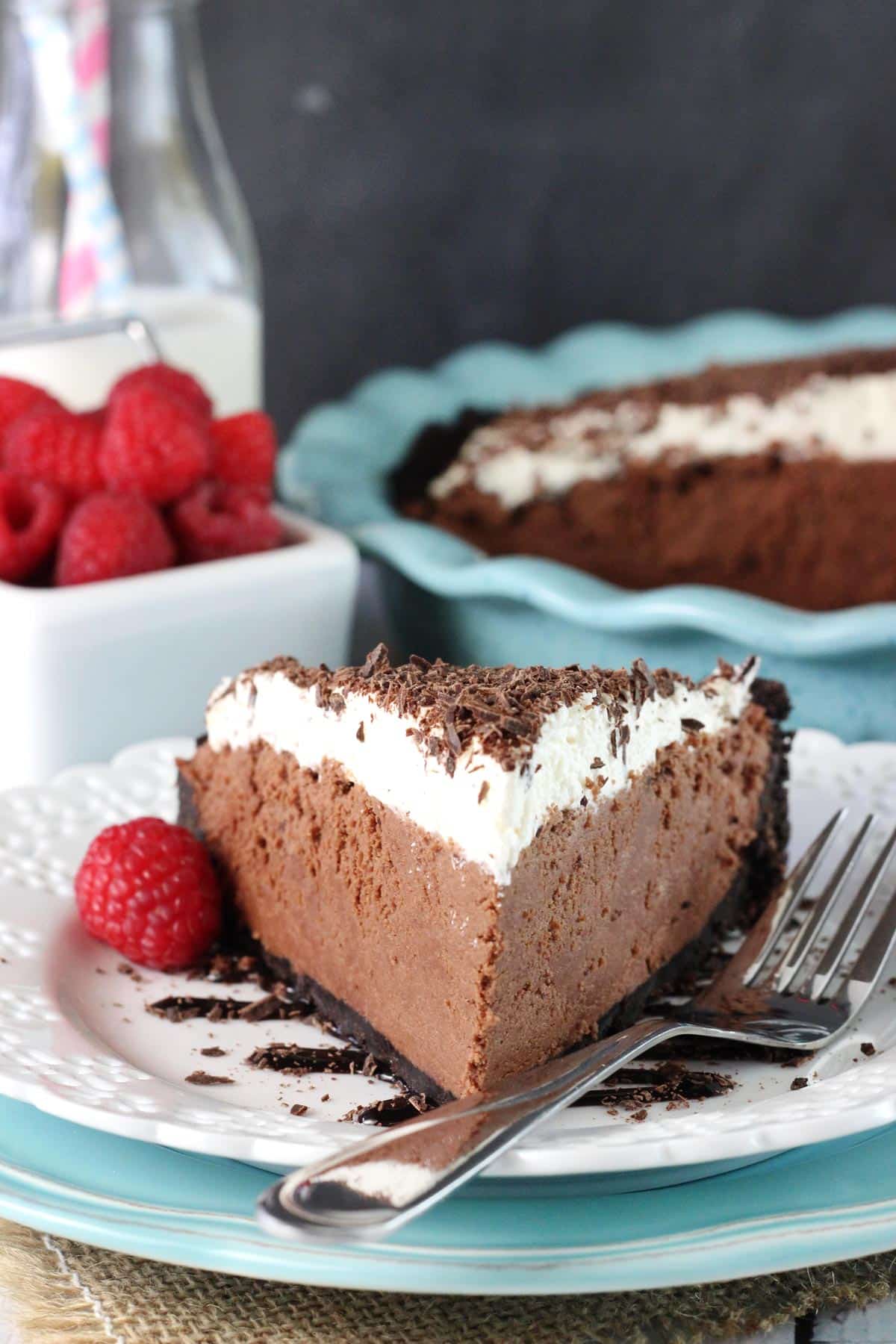 A slice of chocolate truffle pie on a white plate.