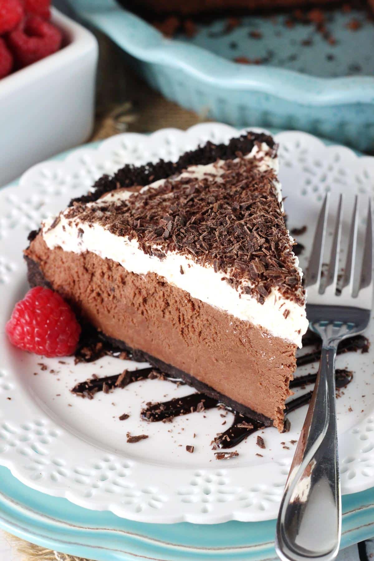A slice of chocolate truffle pie on a white plate.