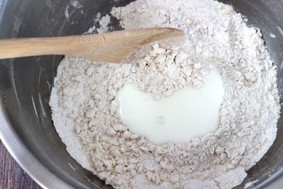 Milk poured into the center of biscuit dough.