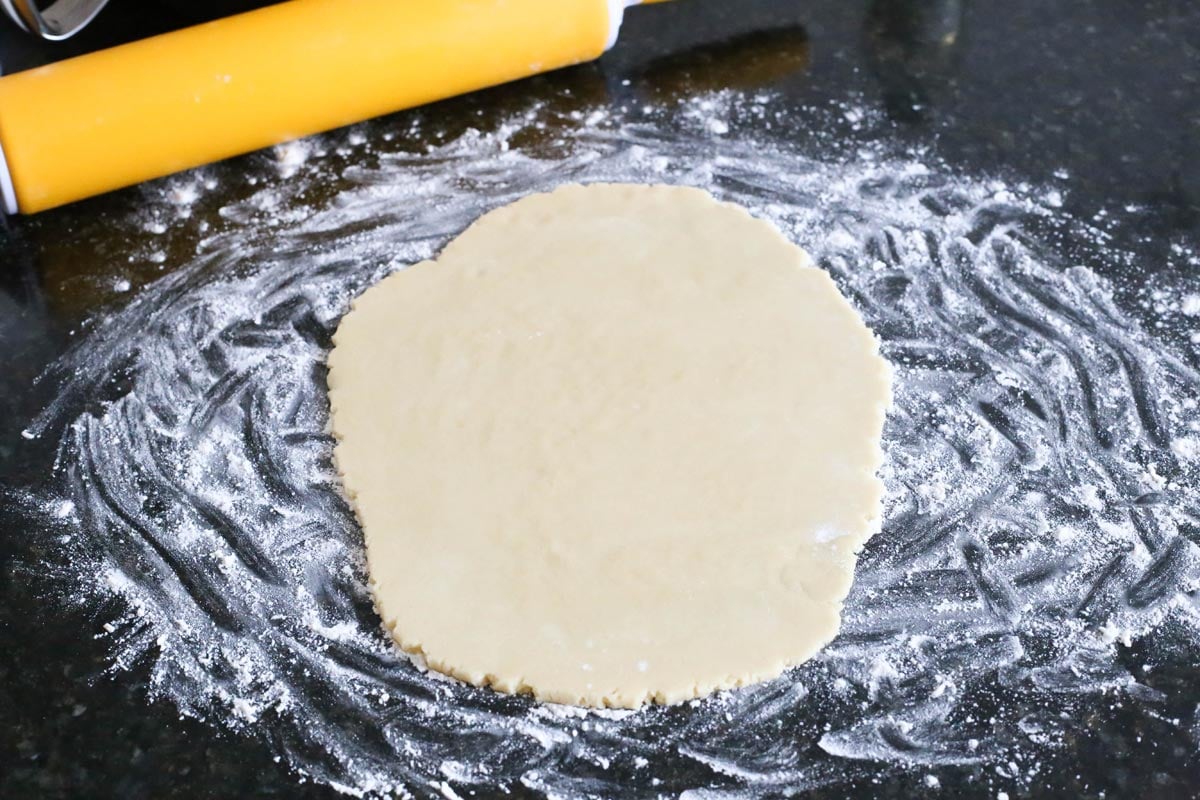 Rolled out sugar cookie dough.