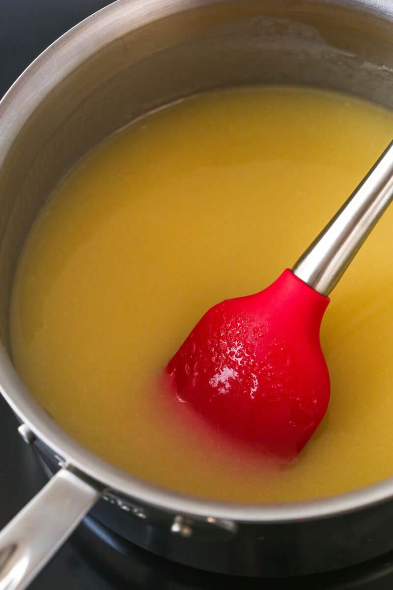 Butter, sugar, and evaporated milk melted together in a saucepan.