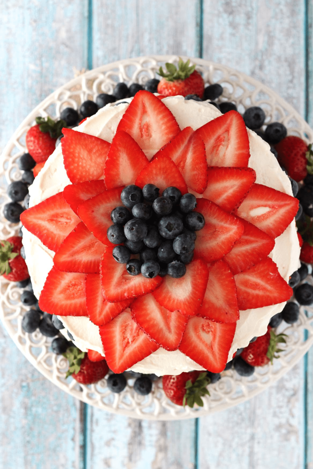Top view of a fresh berry vanilla layered cake.