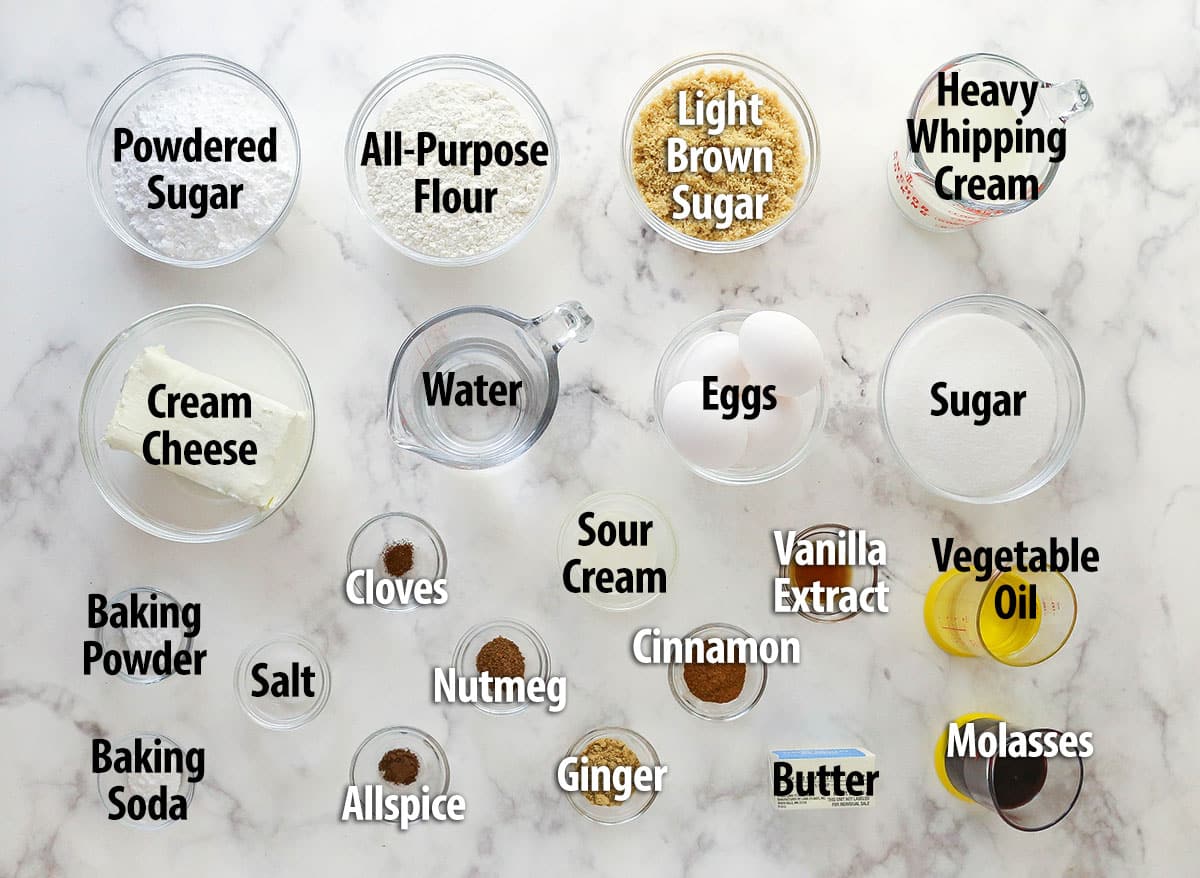 Gingerbread cake roll is a fun alternative to the classic, featuring a moist, spiced cake wrapped around a caramel and cream cheese filling. Labeled ingredients for gingerbread cake roll.