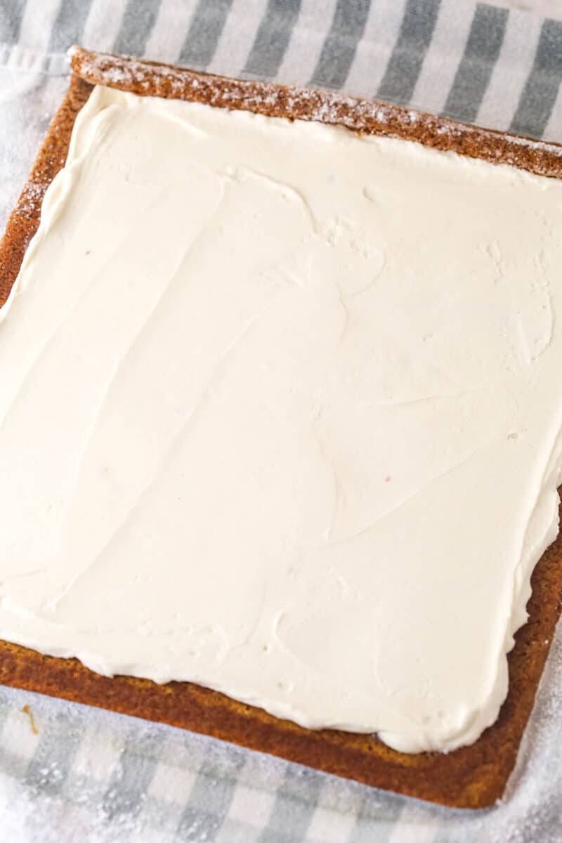 Gingerbread cake roll is a fun alternative to the classic, featuring a moist, spiced cake wrapped around a caramel and cream cheese filling. A layer of cream cheese whipped cream spread over gingerbread cake.