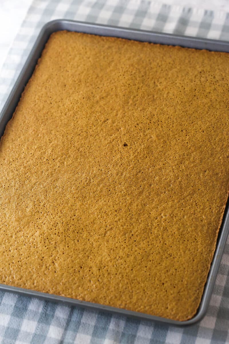 Gingerbread cake roll is a fun alternative to the classic, featuring a moist, spiced cake wrapped around a caramel and cream cheese filling. Bake the gingerbread cake for 10 minutes.