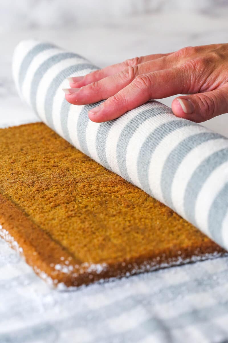 Gingerbread cake roll is a fun alternative to the classic, featuring a moist, spiced cake wrapped around a caramel and cream cheese filling. Turn the gingerbread cake out onto a clean towel and roll.