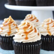 Close up of four Kahlua chocolate cupcakes with salted caramel.