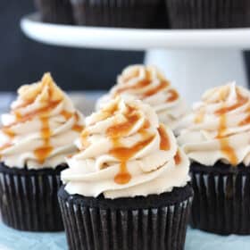 Close up of four Kahlua chocolate cupcakes with salted caramel.