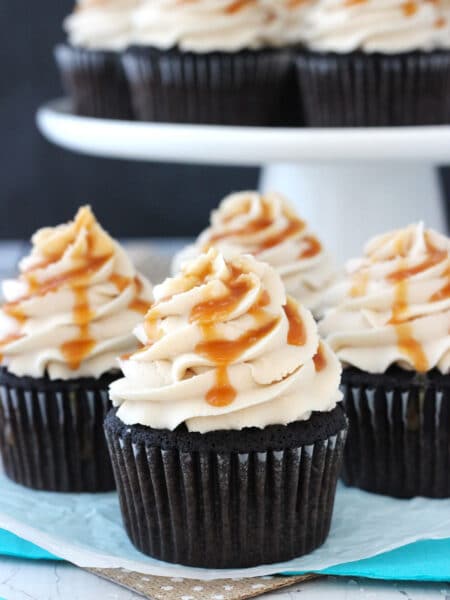 Close up of four Kahlua chocolate cupcakes with salted caramel.
