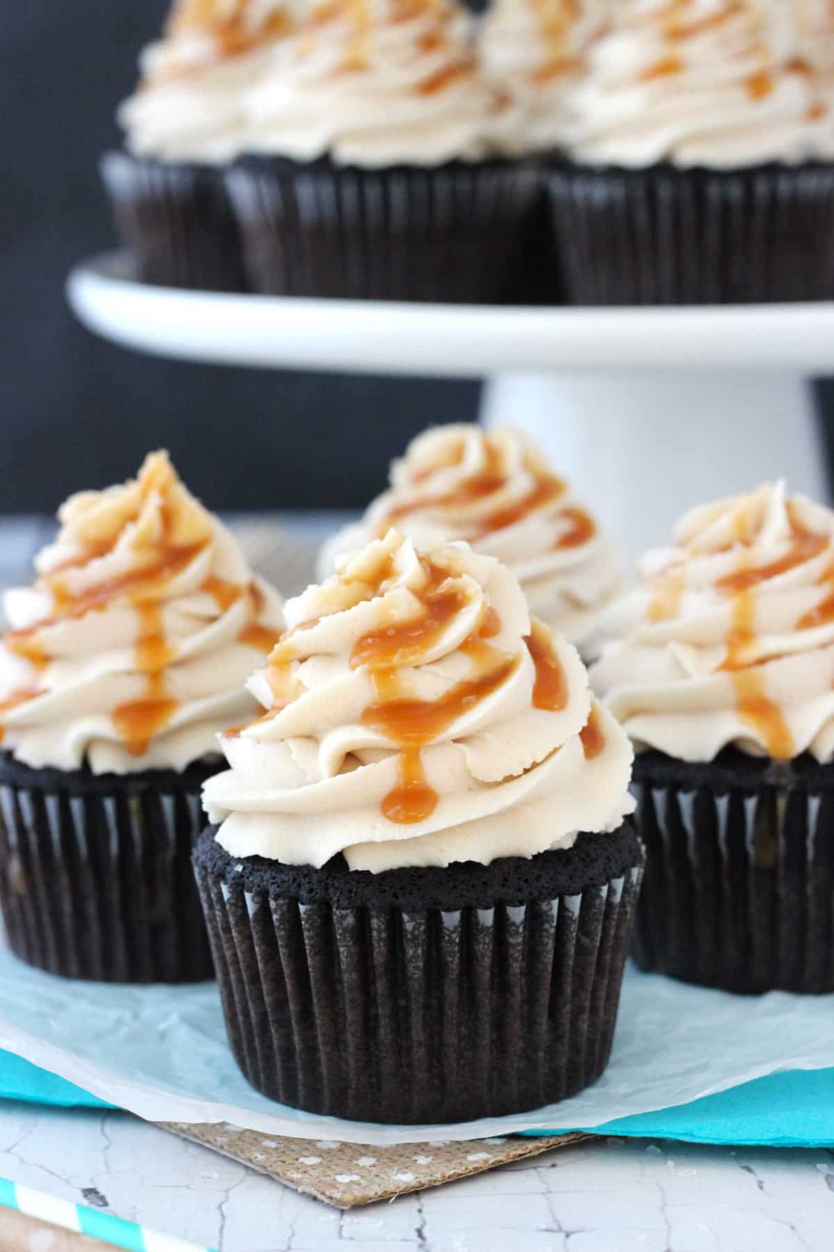 Close up of four Kahlua chocolate cupcakes with salted caramel.