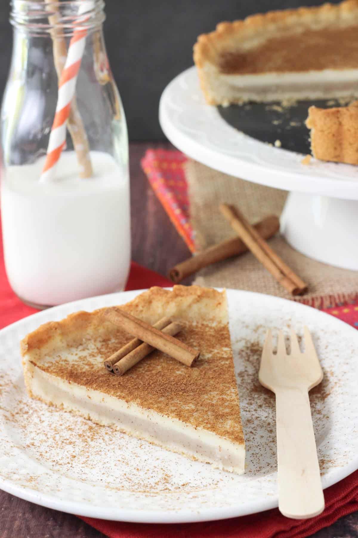 A slice of milk tart on a plate.