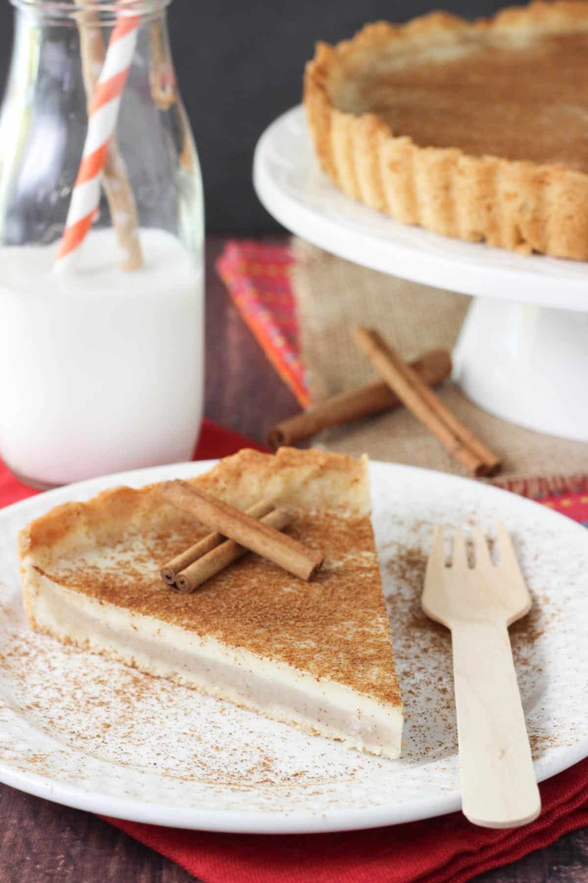A slice of milk tart on a plate.