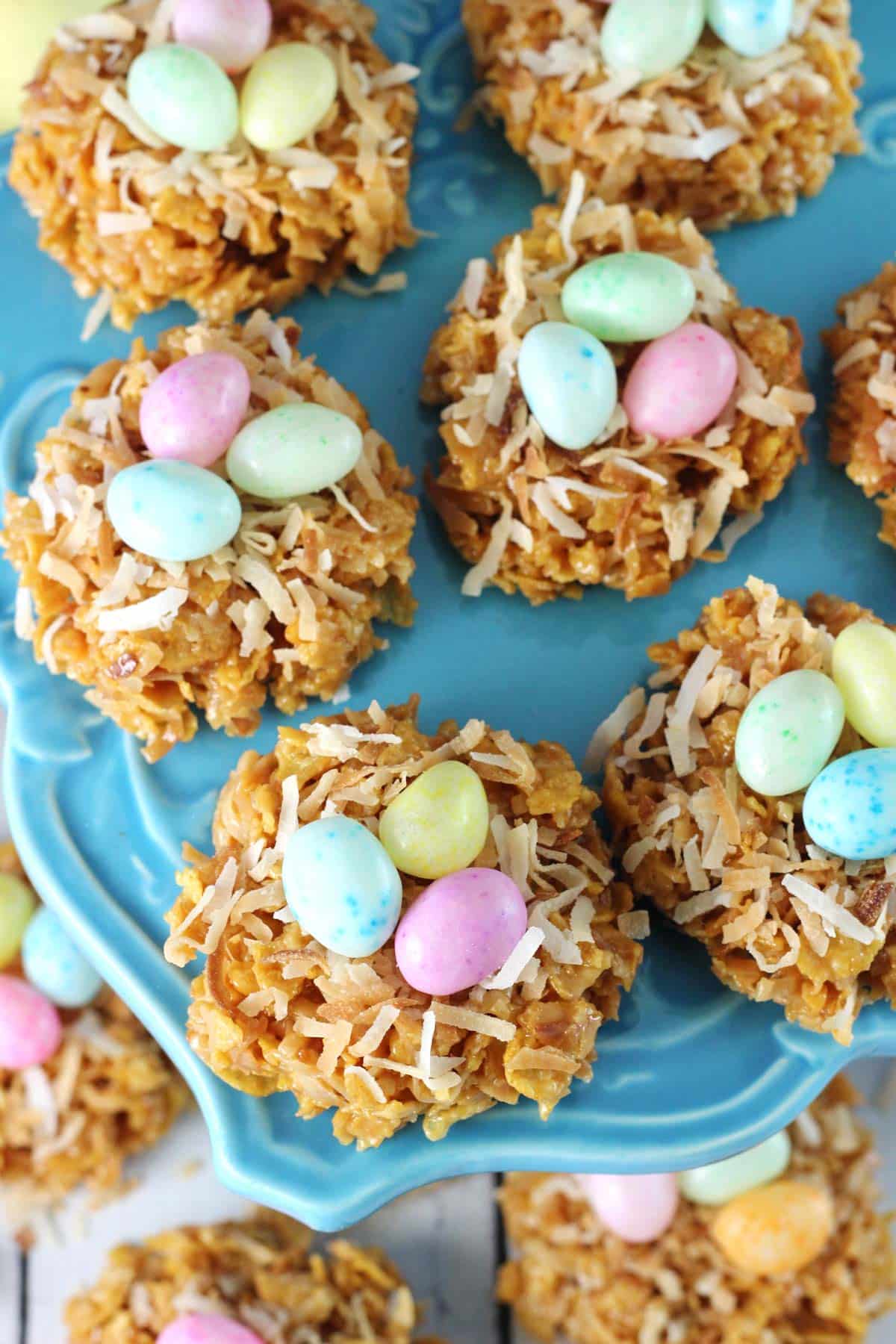 No Bake Coconut Caramel Nest Cookies Close up of no bake caramel coconut nest cookies on a blue plate.