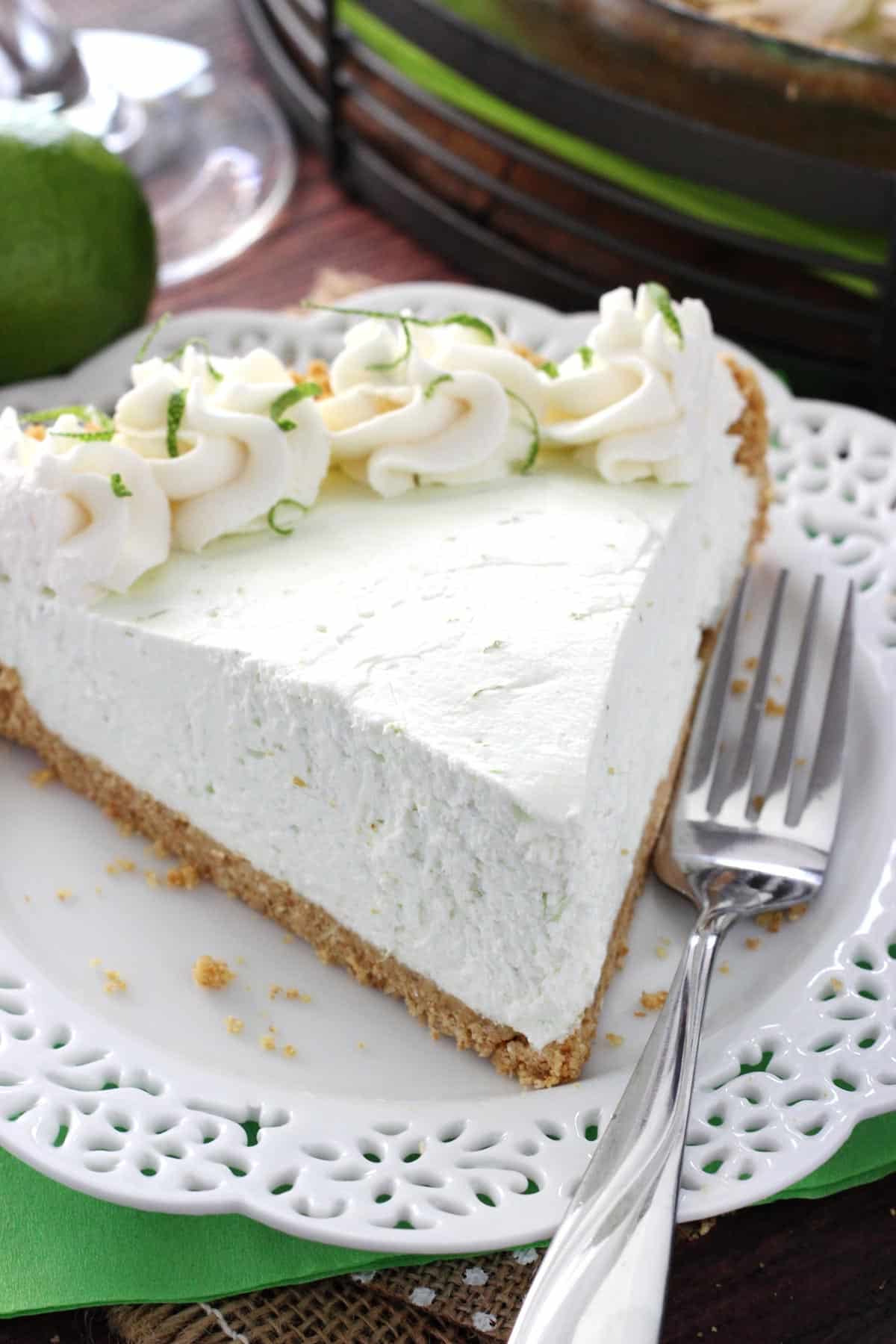 A slice of no bake margarita pie on a white plate.