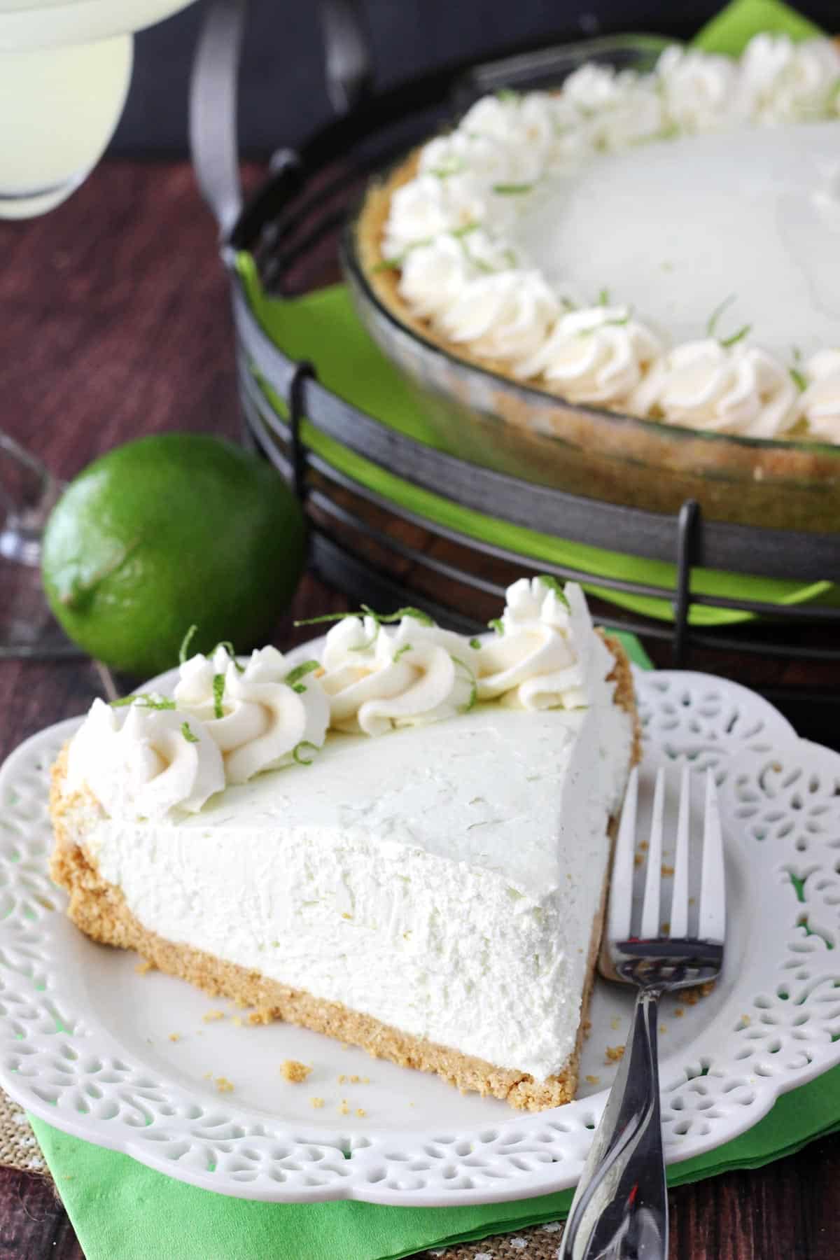 A slice of no bake margarita pie on a white plate.