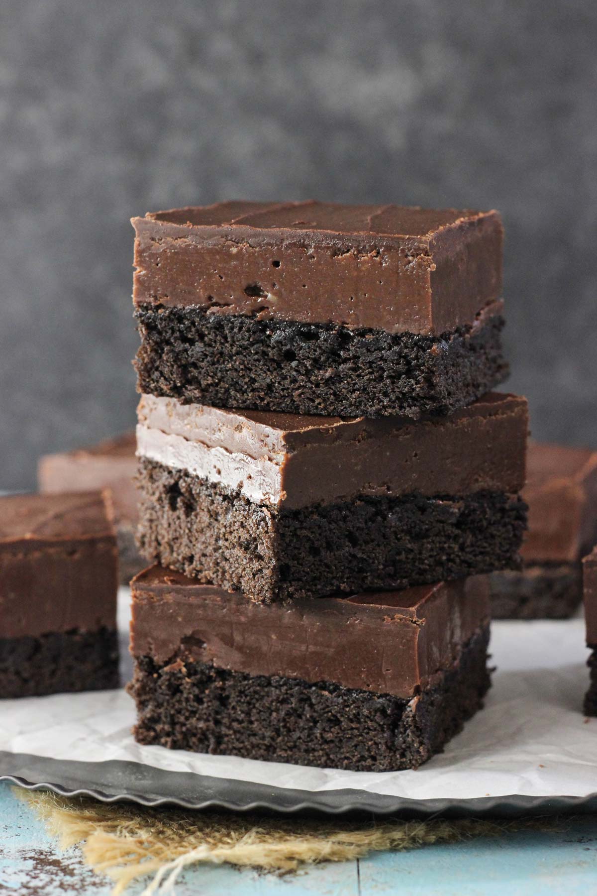 Three Nutella fudge brownies stacked one on top of the other.